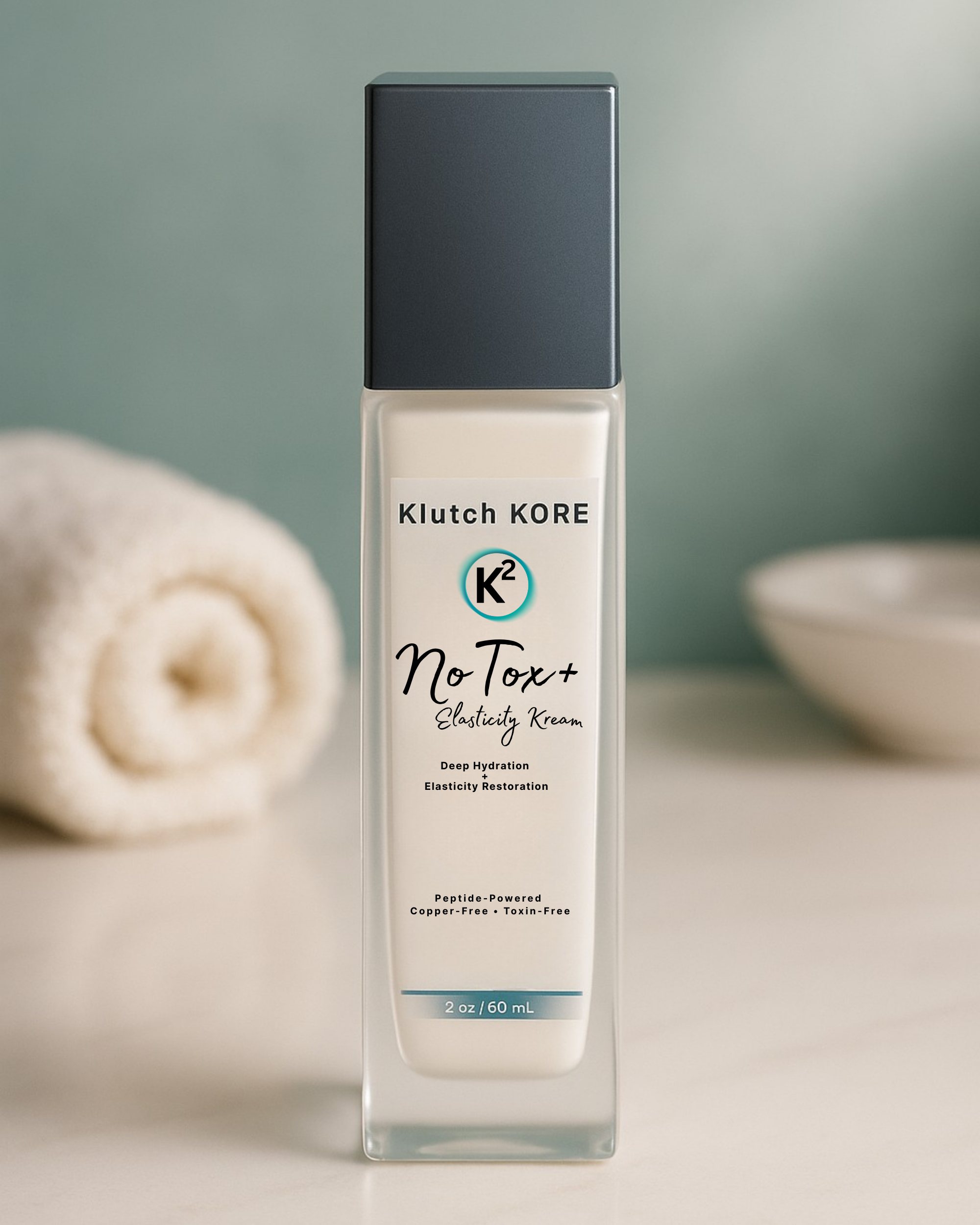 KlutchKORE NoTox+ Elasticity Kream bottle on spa countertop with soft towel in background